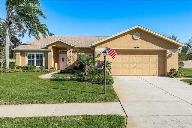 single story home with a garage and a front lawn