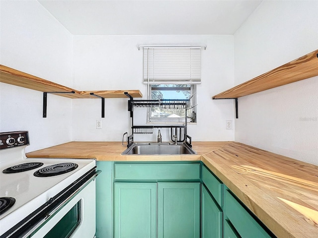 kitchen with white electric range oven, green cabinetry, sink, and wooden counters