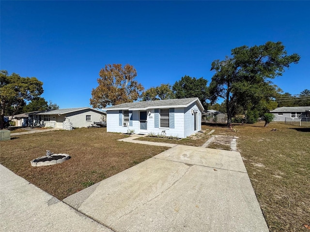 ranch-style house with a front lawn