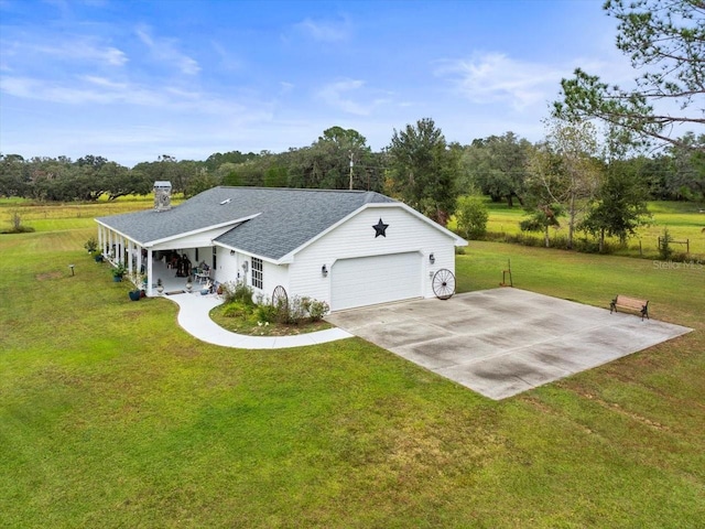 view of front of home featuring a garage and a front lawn