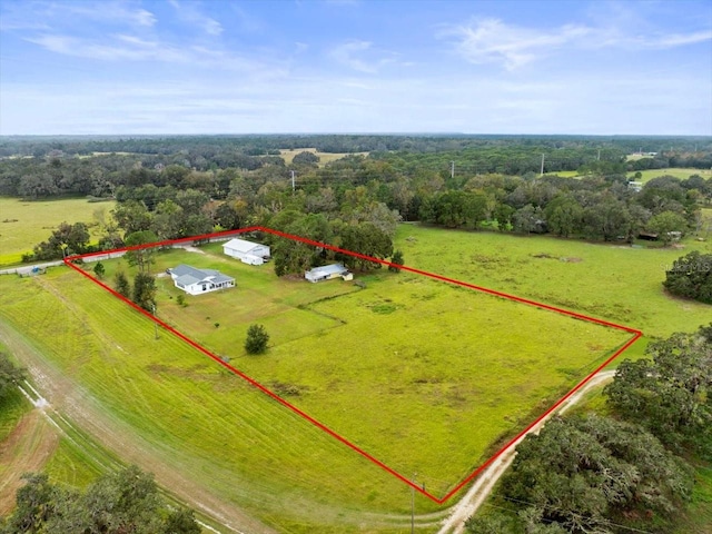 birds eye view of property featuring a rural view