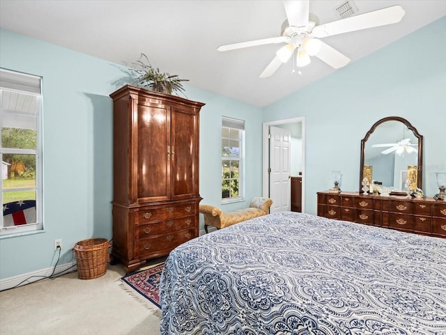 carpeted bedroom featuring vaulted ceiling and ceiling fan