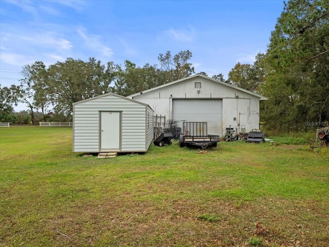 view of outbuilding featuring a yard