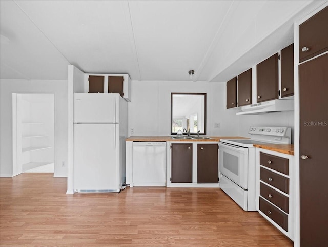 kitchen with light wood-type flooring, white appliances, dark brown cabinetry, and sink