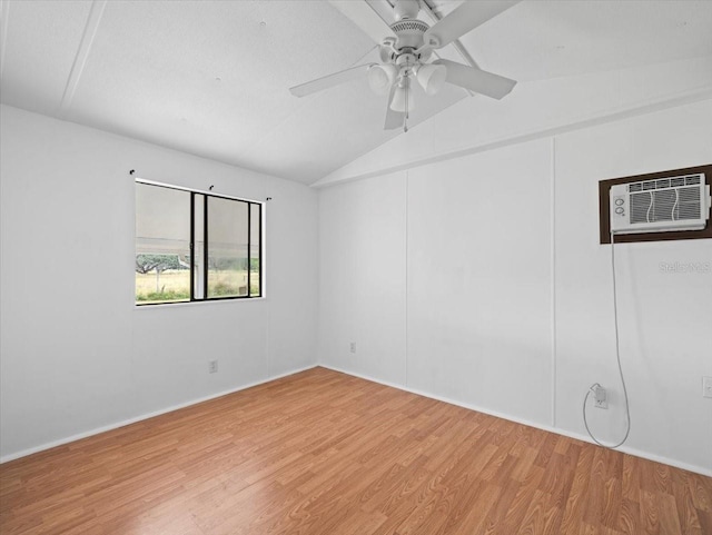 unfurnished room with lofted ceiling, hardwood / wood-style flooring, ceiling fan, a textured ceiling, and a wall mounted AC