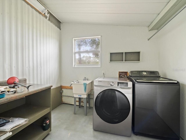 washroom featuring separate washer and dryer and sink