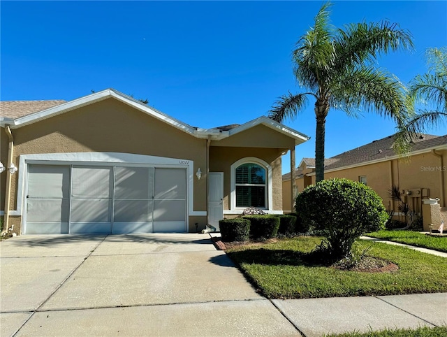 ranch-style house with a front lawn and a garage