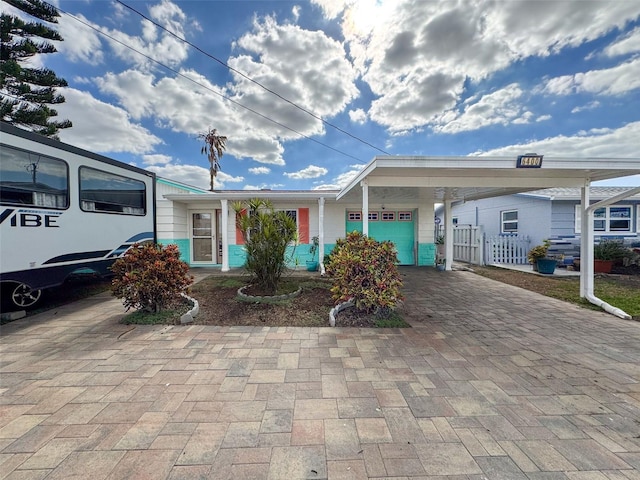 view of front of home with a carport