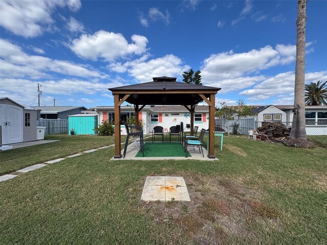 view of yard featuring a gazebo and a shed