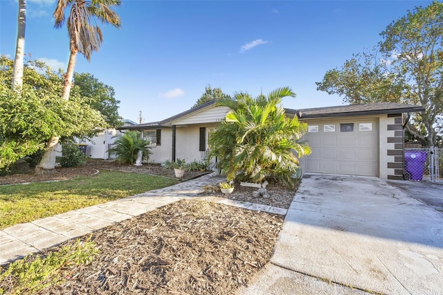 ranch-style house with a front lawn and a garage