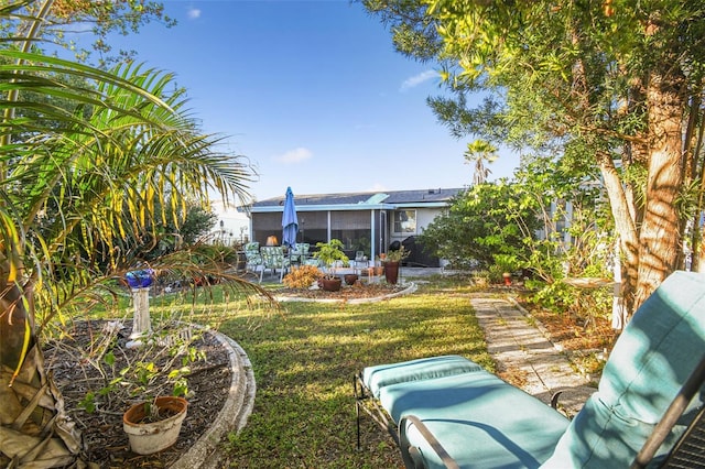 view of yard with a sunroom