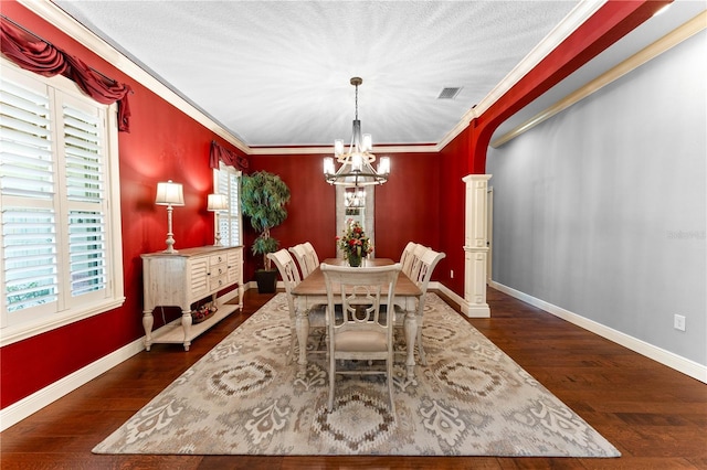 dining area with a chandelier, dark hardwood / wood-style floors, and ornamental molding