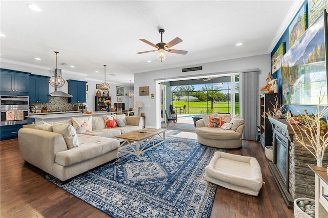 living room with dark hardwood / wood-style floors, ceiling fan, and crown molding