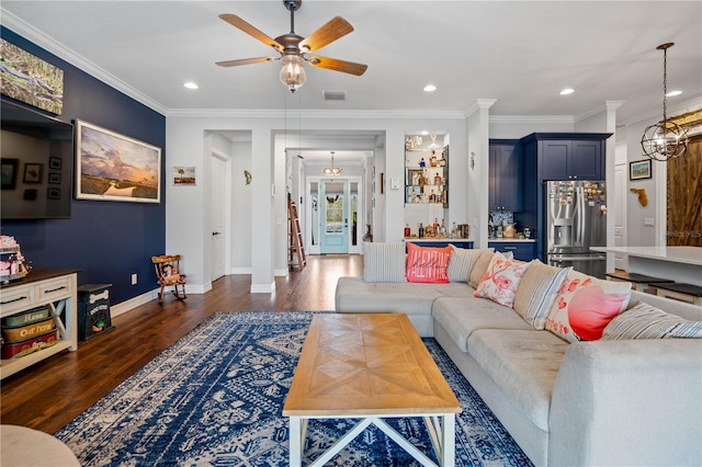 living room featuring ceiling fan, dark hardwood / wood-style floors, and ornamental molding