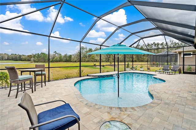 view of pool featuring a lanai, a patio area, and a lawn