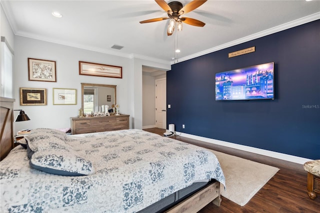 bedroom featuring ceiling fan, dark hardwood / wood-style flooring, and ornamental molding