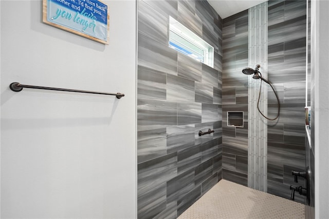 bathroom with tiled shower