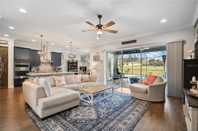 living room featuring crown molding, ceiling fan, and dark wood-type flooring