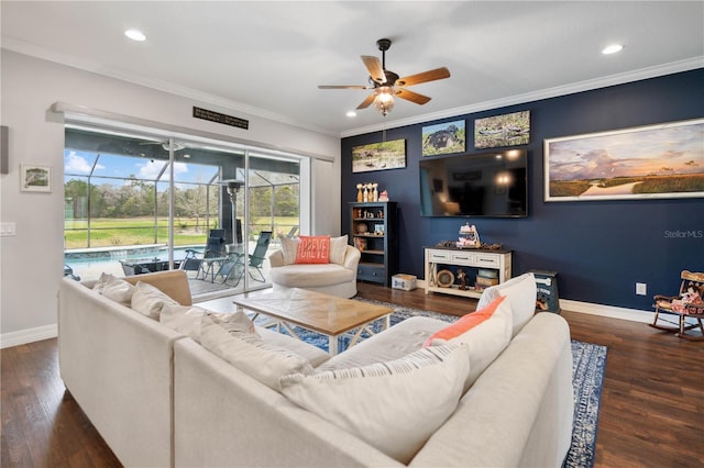 living room with ceiling fan, dark hardwood / wood-style floors, and crown molding