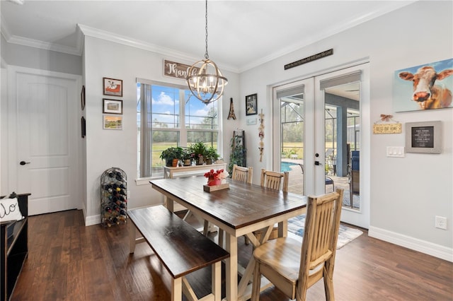 dining area with french doors, dark hardwood / wood-style floors, a wealth of natural light, and ornamental molding