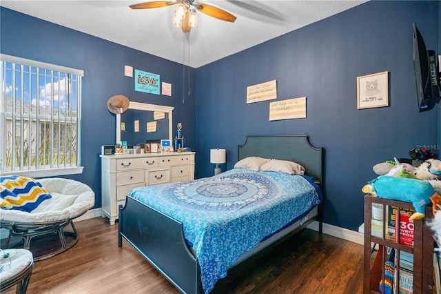 bedroom featuring hardwood / wood-style flooring and ceiling fan