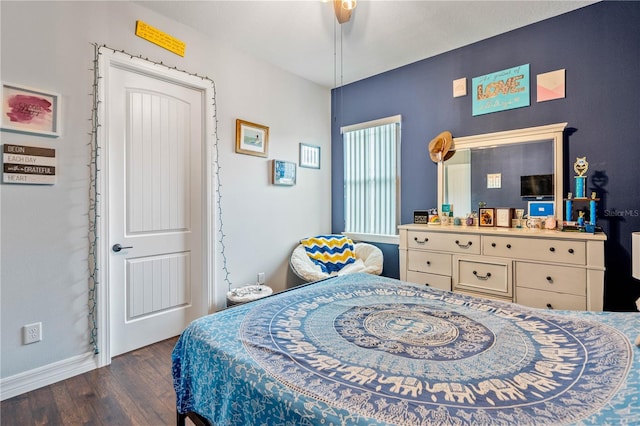 bedroom featuring ceiling fan and dark wood-type flooring