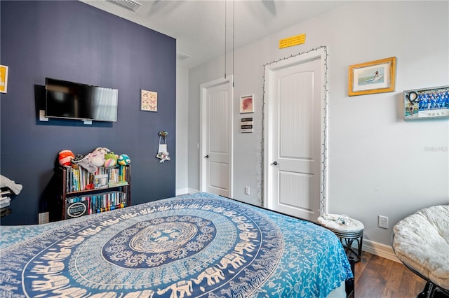 bedroom with wood-type flooring