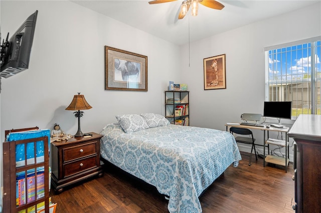 bedroom with ceiling fan and dark hardwood / wood-style flooring