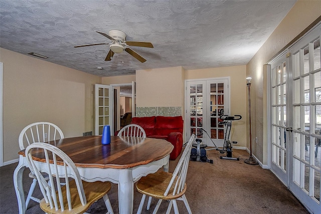 dining room with french doors, carpet floors, a textured ceiling, and ceiling fan