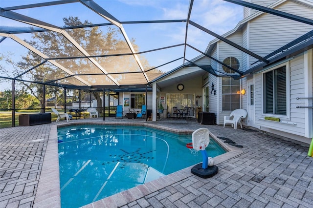 pool featuring a lanai and a patio area