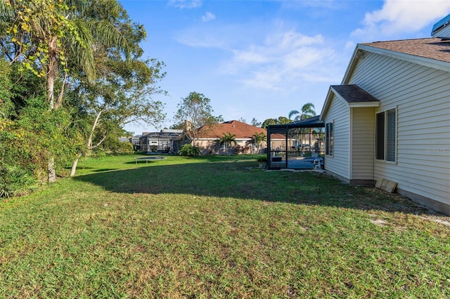 view of yard with a trampoline