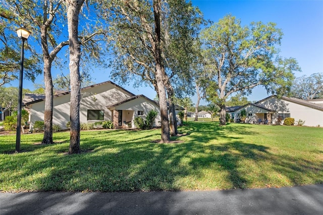 ranch-style house with a front yard