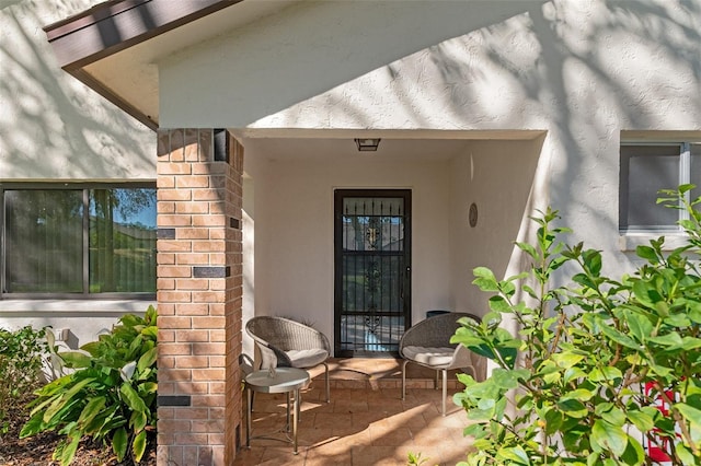 entrance to property with a patio