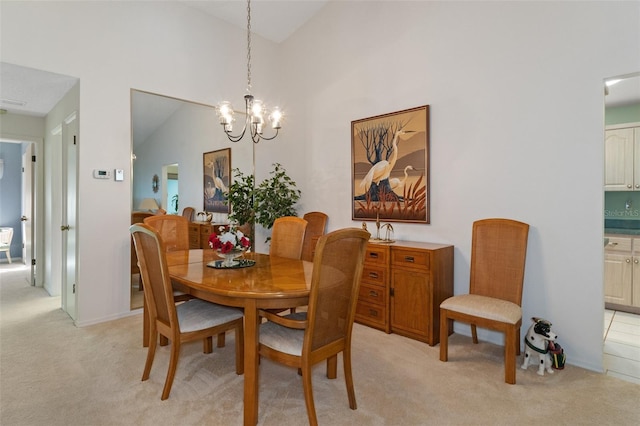 carpeted dining room featuring high vaulted ceiling and a notable chandelier