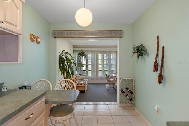 dining space featuring light tile patterned floors