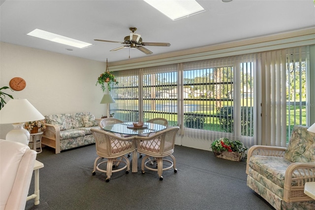 sunroom with ceiling fan and a skylight