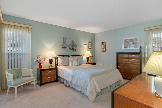 bedroom with light colored carpet