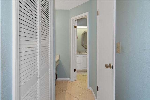 corridor featuring light tile patterned floors