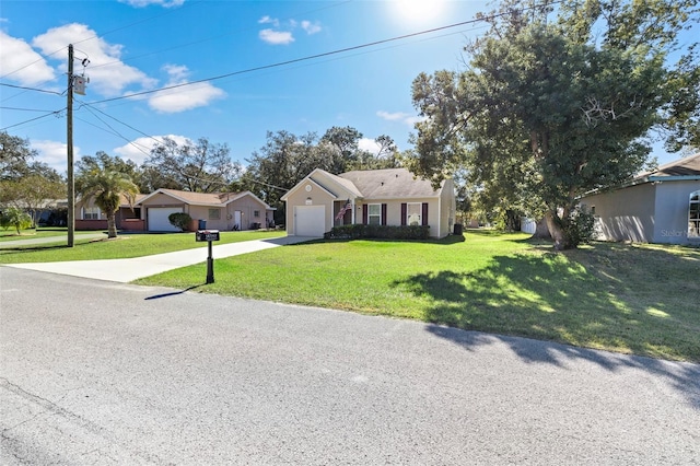 single story home featuring a garage and a front yard