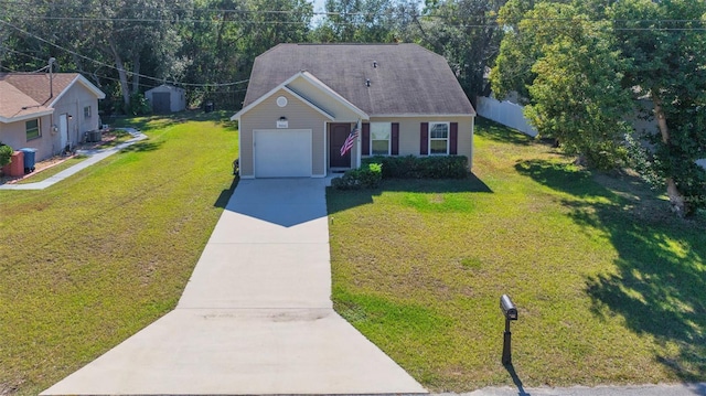 view of front of home with a front lawn and a garage