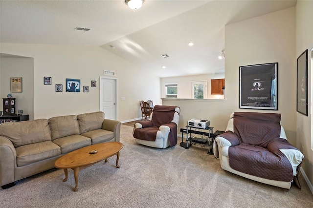 living room with carpet flooring and vaulted ceiling