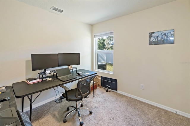 office space featuring light carpet