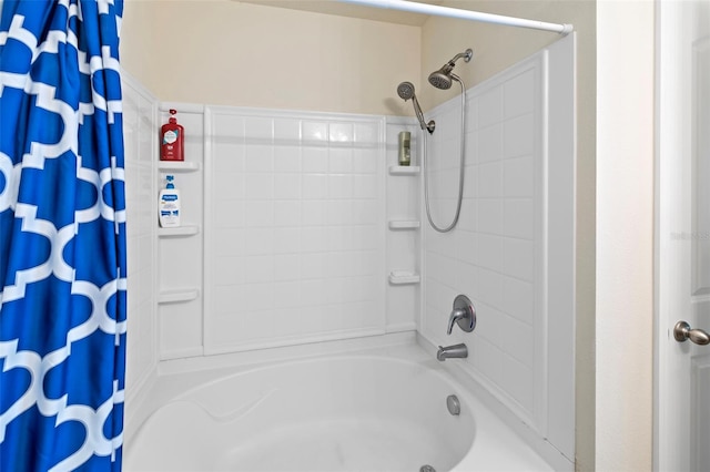 bathroom with shower / bathtub combination with curtain