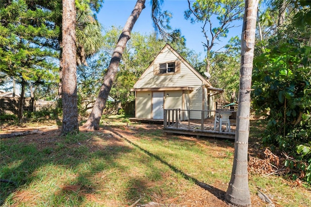 view of yard with an outdoor structure and a deck