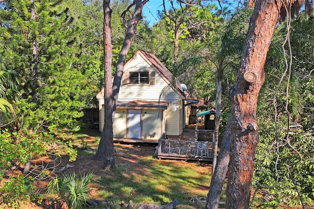 view of property exterior featuring a deck