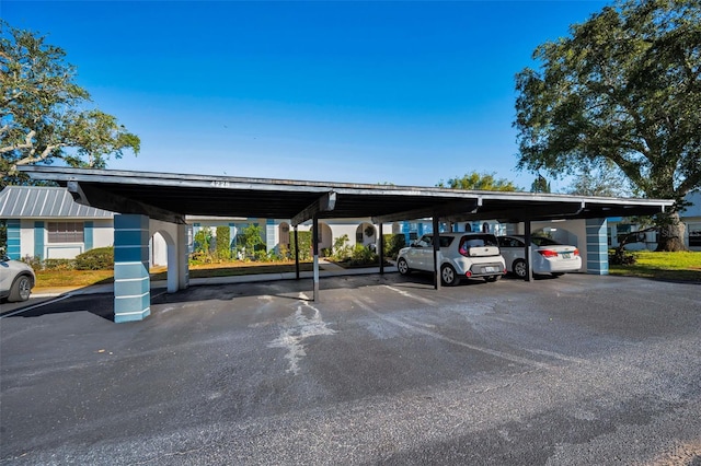 view of parking / parking lot with a carport