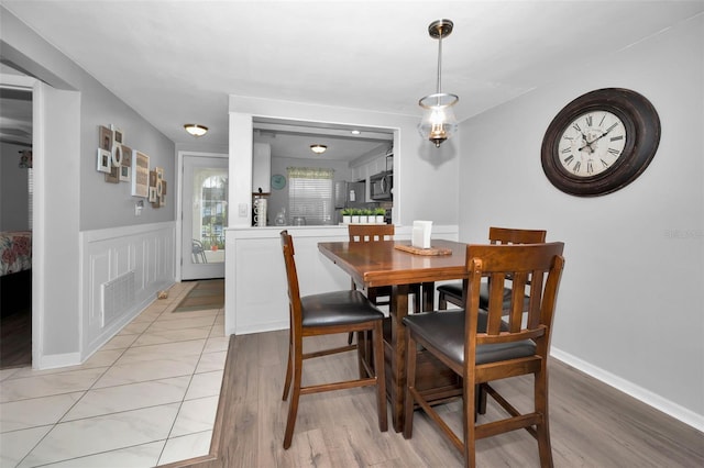 dining area featuring light wood-type flooring