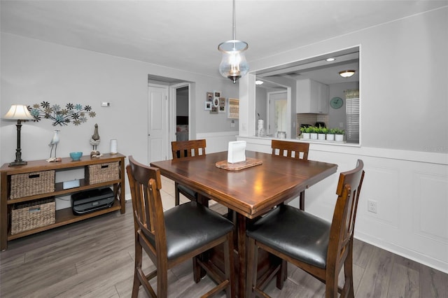 dining area featuring wood-type flooring