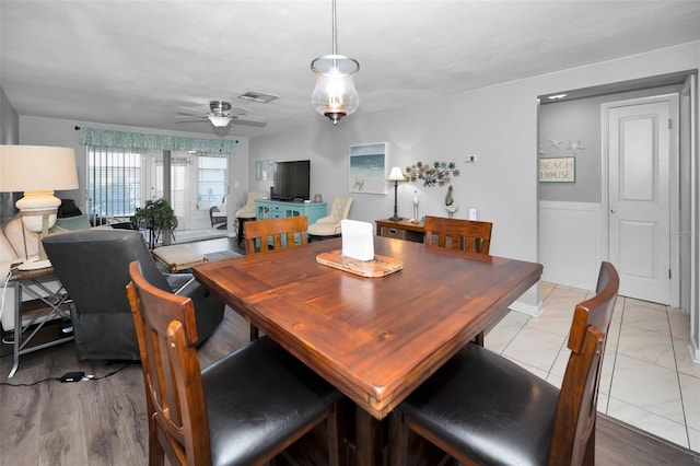 dining space featuring light hardwood / wood-style flooring and ceiling fan