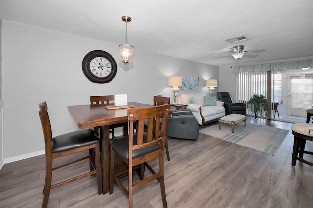 dining room featuring hardwood / wood-style flooring and ceiling fan